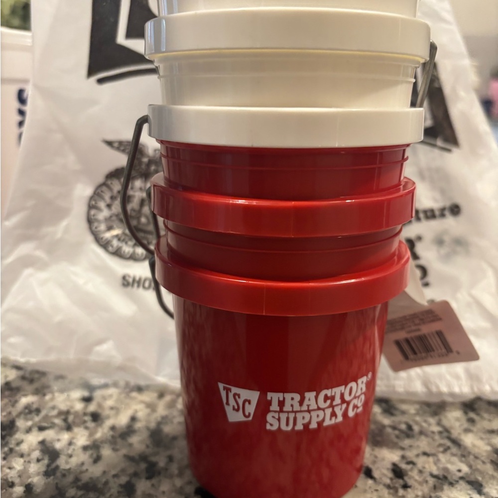 Tractor Supply Co. Red and White Buckets
